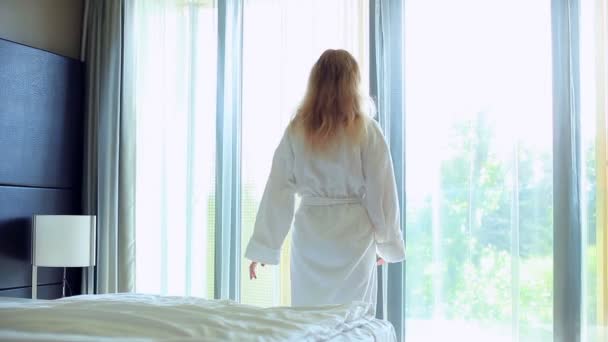 Young woman standing at the window. - Filmagem, Vídeo