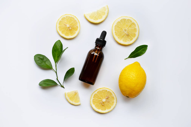 Fresh lemon with lemon essential oil on a white background. - Photo, Image