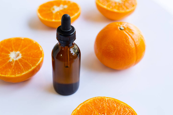 Aceite esencial con naranja
 - Foto, imagen