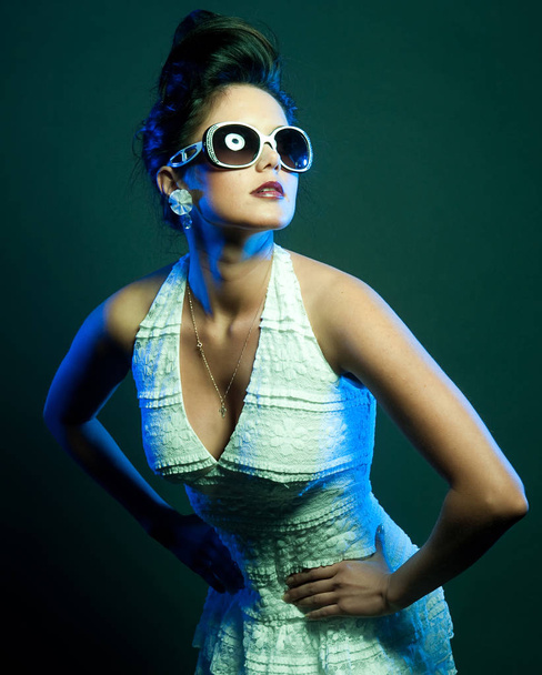 fashion lady with sunglasses posing in studio - 写真・画像