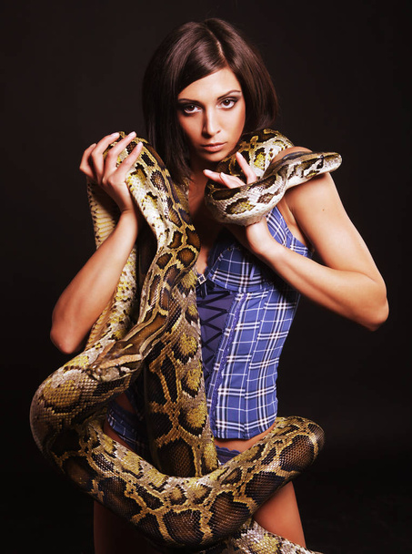 sexy brunette holding python - Фото, зображення