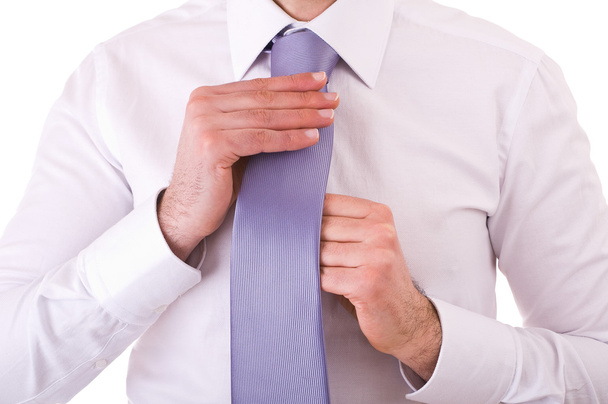 Podnikatel si upravuje kravatu. - Fotografie, Obrázek