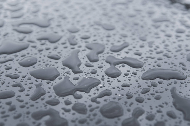 Natural water drops on a glass table after rain. - Valokuva, kuva