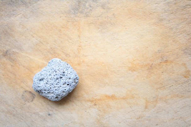 Pumice stone on wooden board - Foto, Imagem