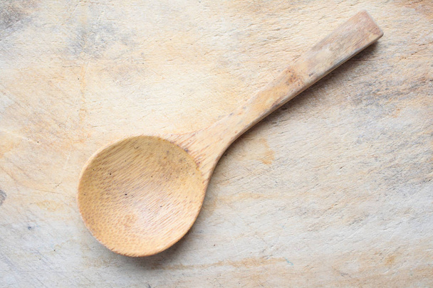 Wooden spoon on a wooden board - Photo, Image