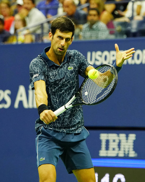 NEW YORK - SEPTEMBER 7, 2018: 13-time Grand Slam champion Novak Djokovic of Serbia in action during his 2018 US Open Round of 32 match at Billie Jean King National Tennis Center - Фото, изображение