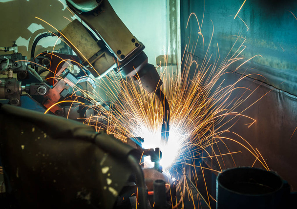 welding robots represent the movement. In the automotive parts industry. - Photo, Image