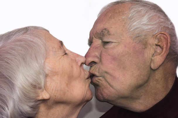 The senior woman kissing old man - 写真・画像