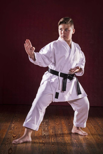 Black belt karate martial arts kid exhibition. - Фото, изображение
