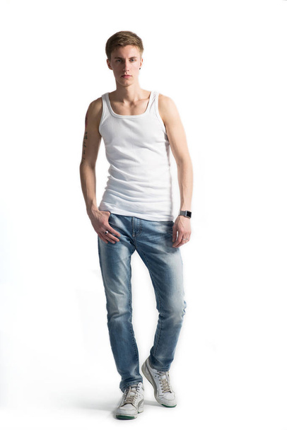 Young man in casual clothes posing on white background - Фото, изображение