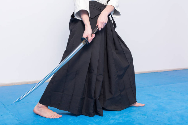 A man with katana on Iaido practice - 写真・画像