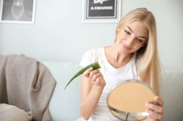Beautiful young woman using aloe vera at home - Foto, immagini