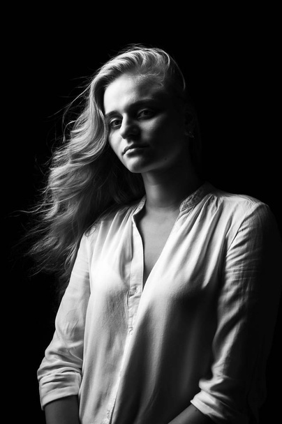 Young girl in white shirt shirt on black backgroun - Fotografie, Obrázek