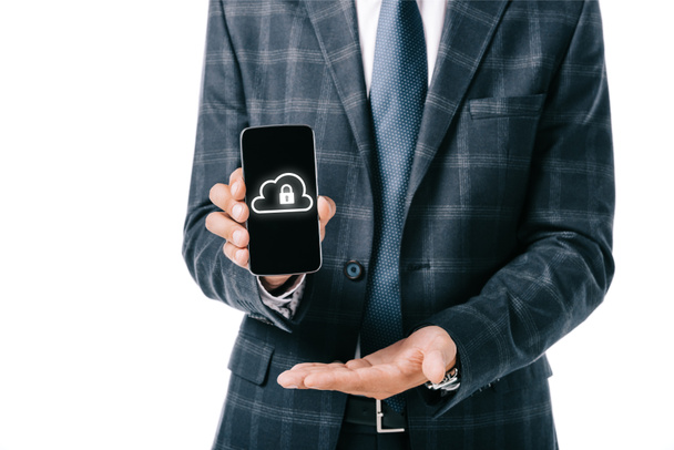cropped shot of businessman in suit showing smartphone with cyber security sign on screen isolated on white - Fotoğraf, Görsel