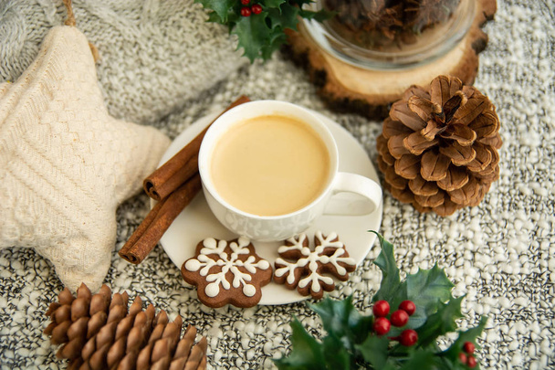 Morning coffee in a cup. Christmas composition. Cup of coffee, anise star, christmas cookies. top view - Foto, imagen