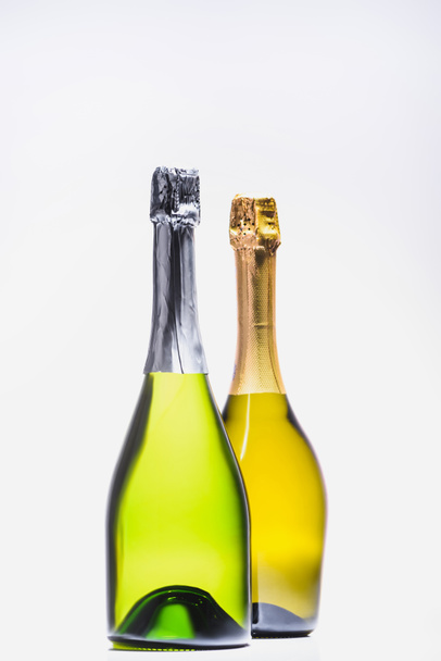 close up view of bottles of champagne isolated on white - Foto, Imagen