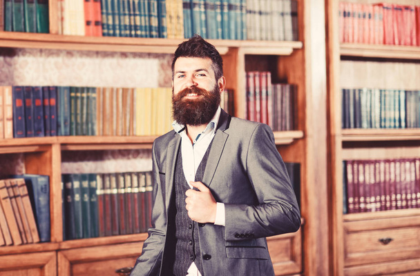 Hipster stands in luxury interior and looks happy. - Foto, imagen