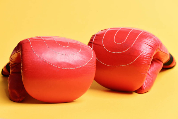 Pair of boxing gloves lying next to each other - 写真・画像