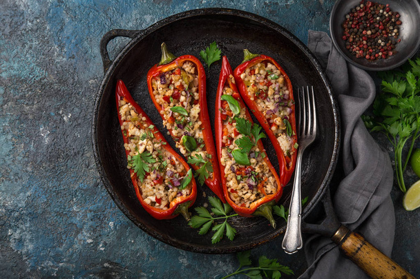 bell peppers stufed with pearl couscous and vegetables, top view - Фото, зображення