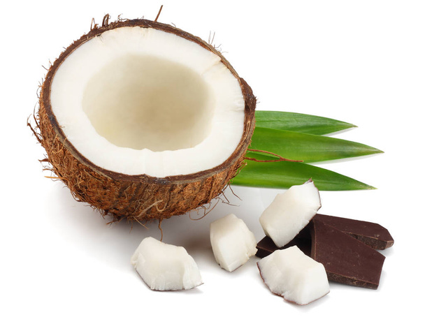 Coconut with chocolate and green leaves isolated on white background - Photo, Image