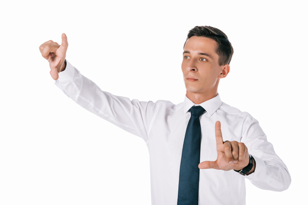 portrait of concentrated businessman gesturing isolated on white - Φωτογραφία, εικόνα