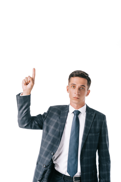 portrait of businessman in suit pointing up isolated on white - Photo, Image