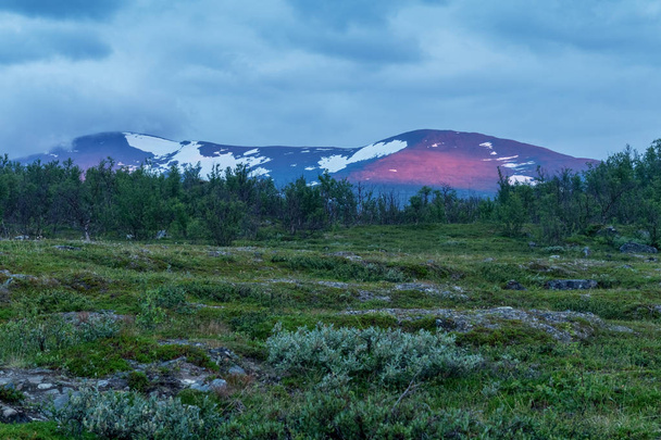 Red sunbeam on a mountain in a polar day, Abisko National Park, Sweden - Zdjęcie, obraz