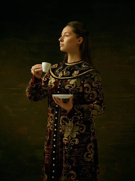 Girl standing in Russian traditional costume. - 写真・画像