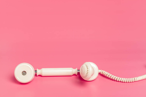 Retro white telephone on pink background - Photo, Image