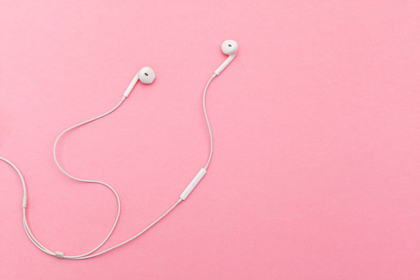 close up of Earphones on color background. - Foto, afbeelding