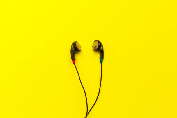 close up of Earphones on color background. - Foto, afbeelding