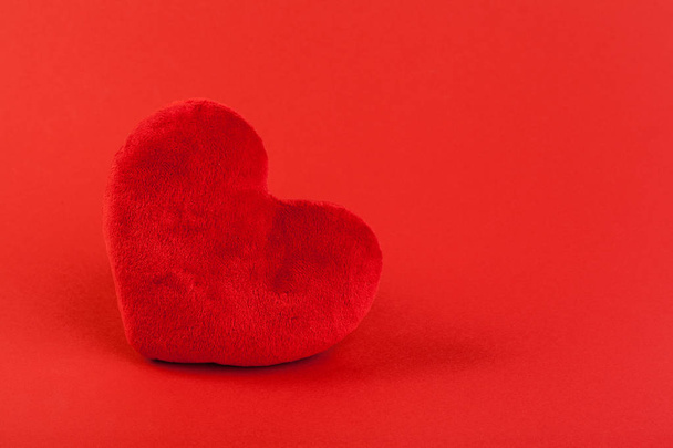Red heart on color background. minimal concept. - Fotografie, Obrázek