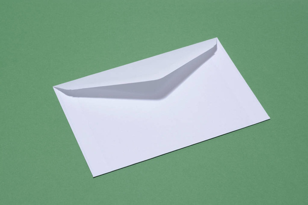 Envelope on green background - Valokuva, kuva
