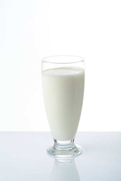 Glass of milk on white background - Foto, immagini