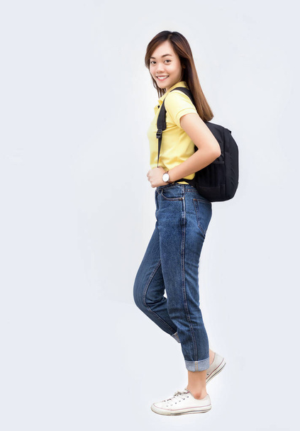 asian teenage hold backpack belt and walk action on white isolate background in back to school concept - Foto, immagini