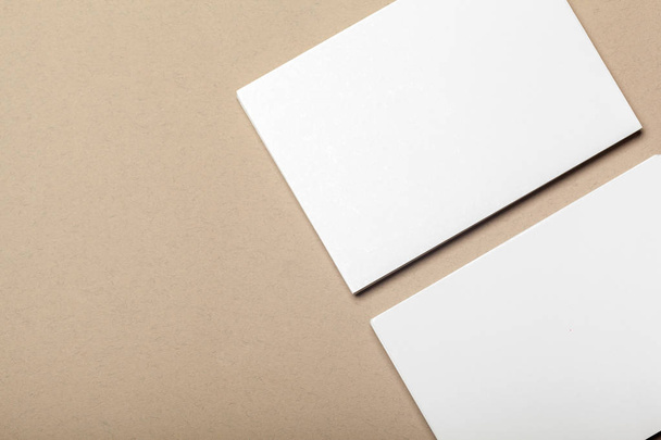 Blank paper pieces for mock up on a beige background - Photo, Image