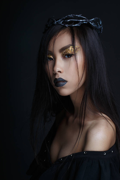 Beautiful girl with crown and bright make up on black background - Valokuva, kuva