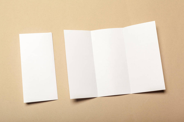 Blank paper pieces for mock up on a beige background - Foto, Imagen