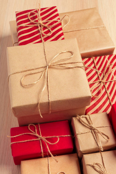 close up of Christmas gift boxes on table - Foto, Imagen