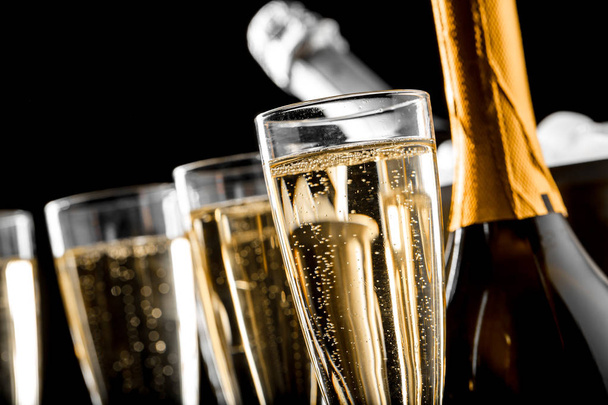 close up of glasses of champagne with the bottles - Foto, Imagen