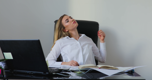 Tired busy woman sitting on chair in the office - Footage, Video