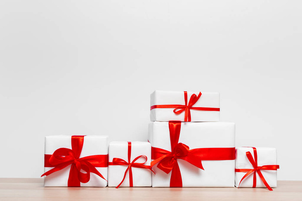 close up of Christmas gift boxes on table - Φωτογραφία, εικόνα