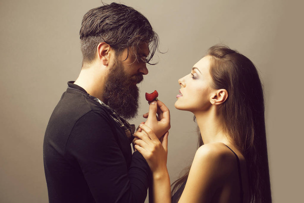 sexy couple eating red strawberry - Photo, Image