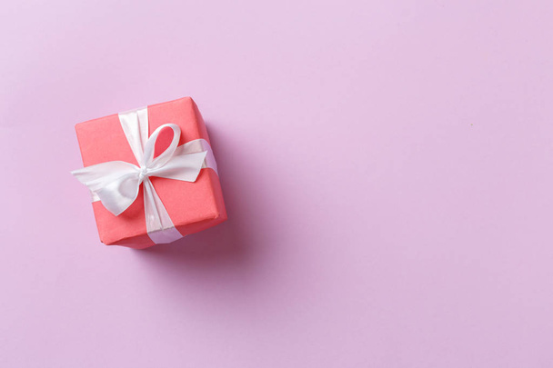close up of gift box on colorful background - Foto, imagen