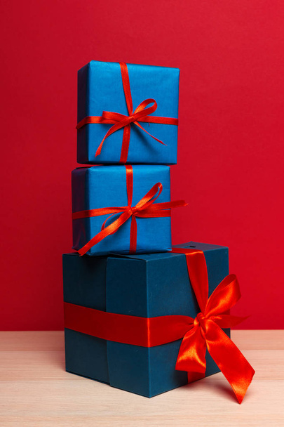 close up of Christmas gift boxes on table - Foto, Imagem