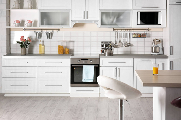 Light modern kitchen interior with new oven - Foto, Imagem