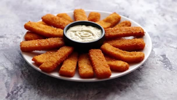 Crumbed fish sticks served with garlic dip sauce - Footage, Video