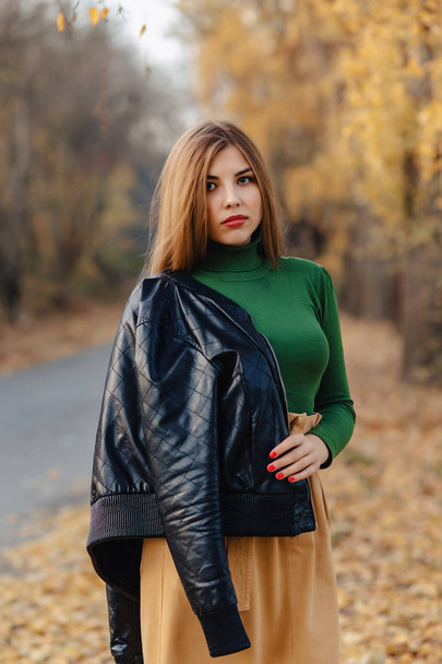 cozy stylish young girl walk at autumn colorful park alone - Foto, Bild