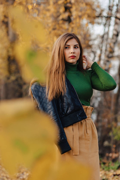 cozy stylish young girl walk at autumn colorful park alone - Fotografie, Obrázek