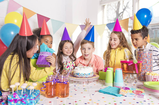 group of children at birthday party at home - Фото, изображение